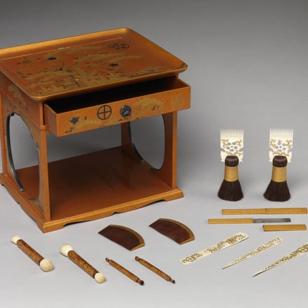 Cosmetic stand (kushi-dai) with pine, bamboo, and cherry blossom from a wedding set. Edo period (1615–1868), early 19th century. Lacquered wood with gold, silver takamaki-e, hiramaki-e, cut-out gold foil application on nashiji ground. H. 10 5/8 in. (27 cm