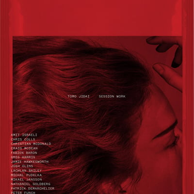 ヘアスタイリストTOMO JIDAIによる作品をまとめた写真集の赤を基調とした表紙