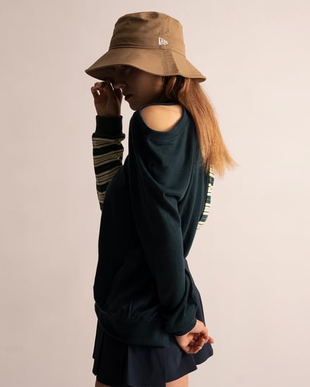 フォーゲットミーノッツが代官山本店で展開するニューエラの帽子を着用したモデル