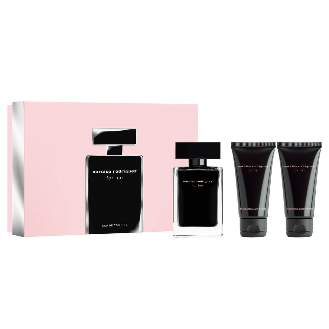 ピンクの箱の横に、黒い香水ボトル、黒いパッケージのボディローションとシャワージェルが並んでいる