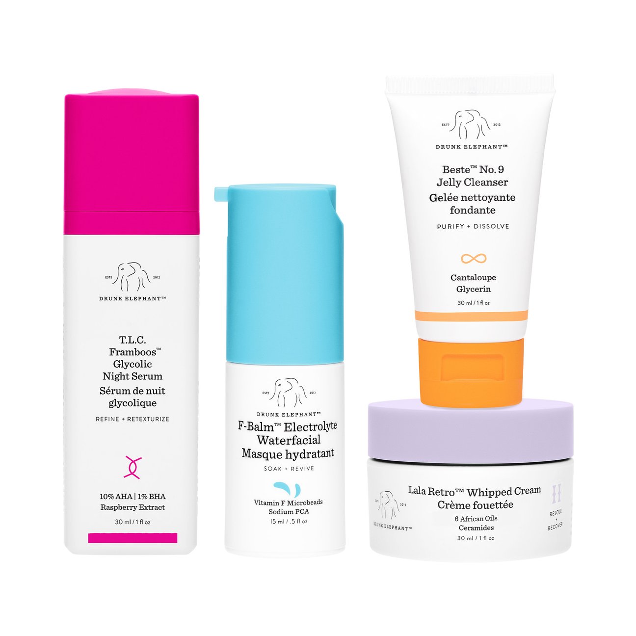ピンク、水色、オレンジ、紫のキャップがついたスキンケアアイテム