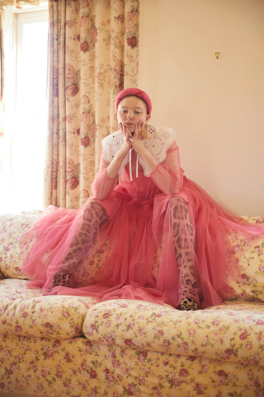 dress by MOLLY GODDARD　FARFETCH CUSTOMER SERVICE, shoes by SERGIO ROSSI　SERGIO ROSSI CUSTOMER SERVICE, headdress and earrings by PATOU　IZA, collar by GANNI　FARFETCH CUSTOMER SERVICE