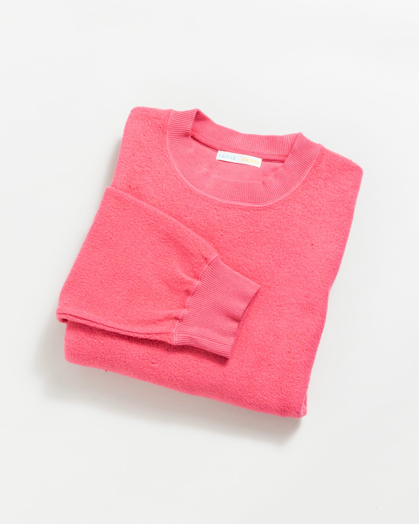 ピンクのスウェット