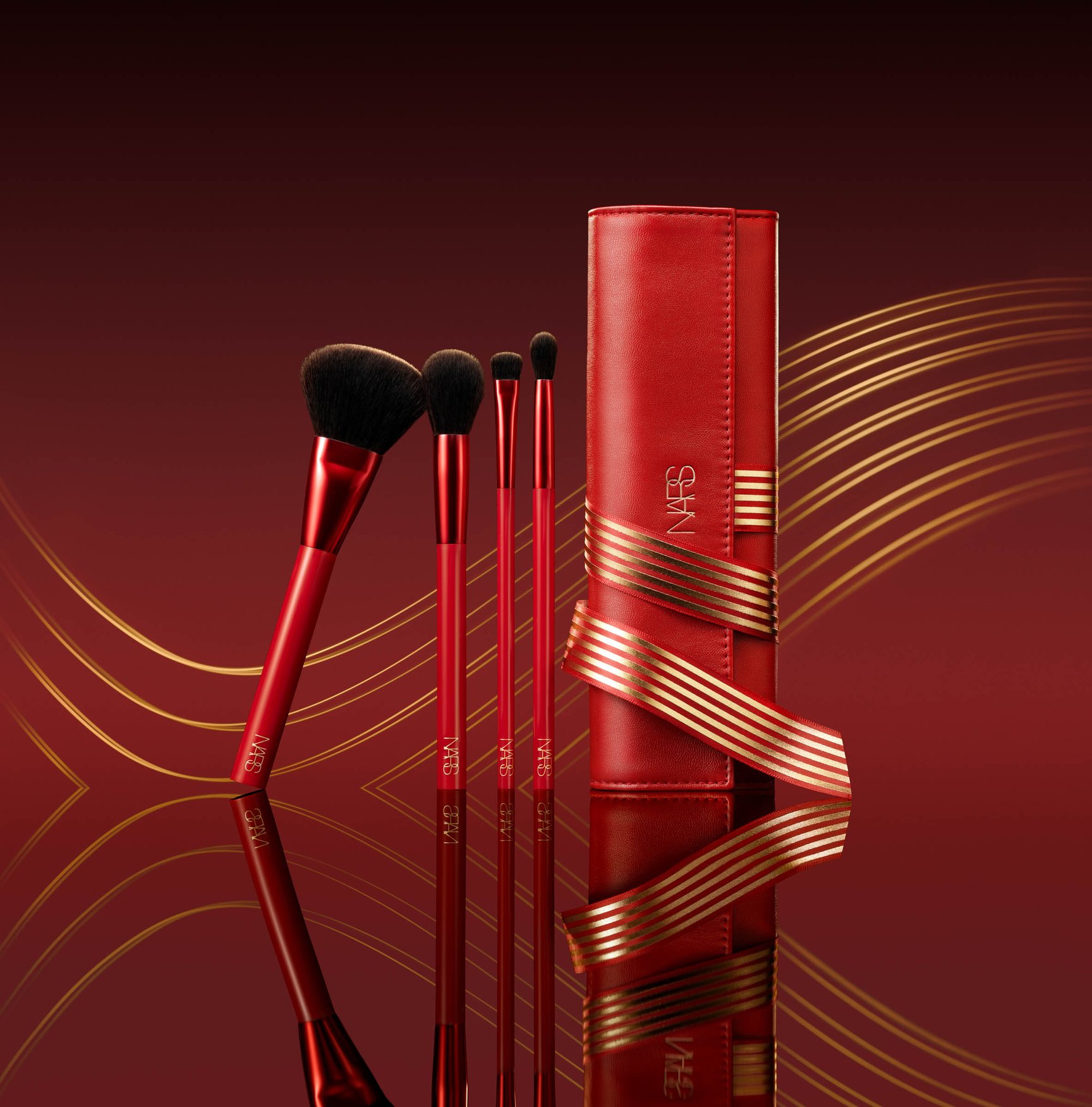 赤い背景に置かれたブラシセット