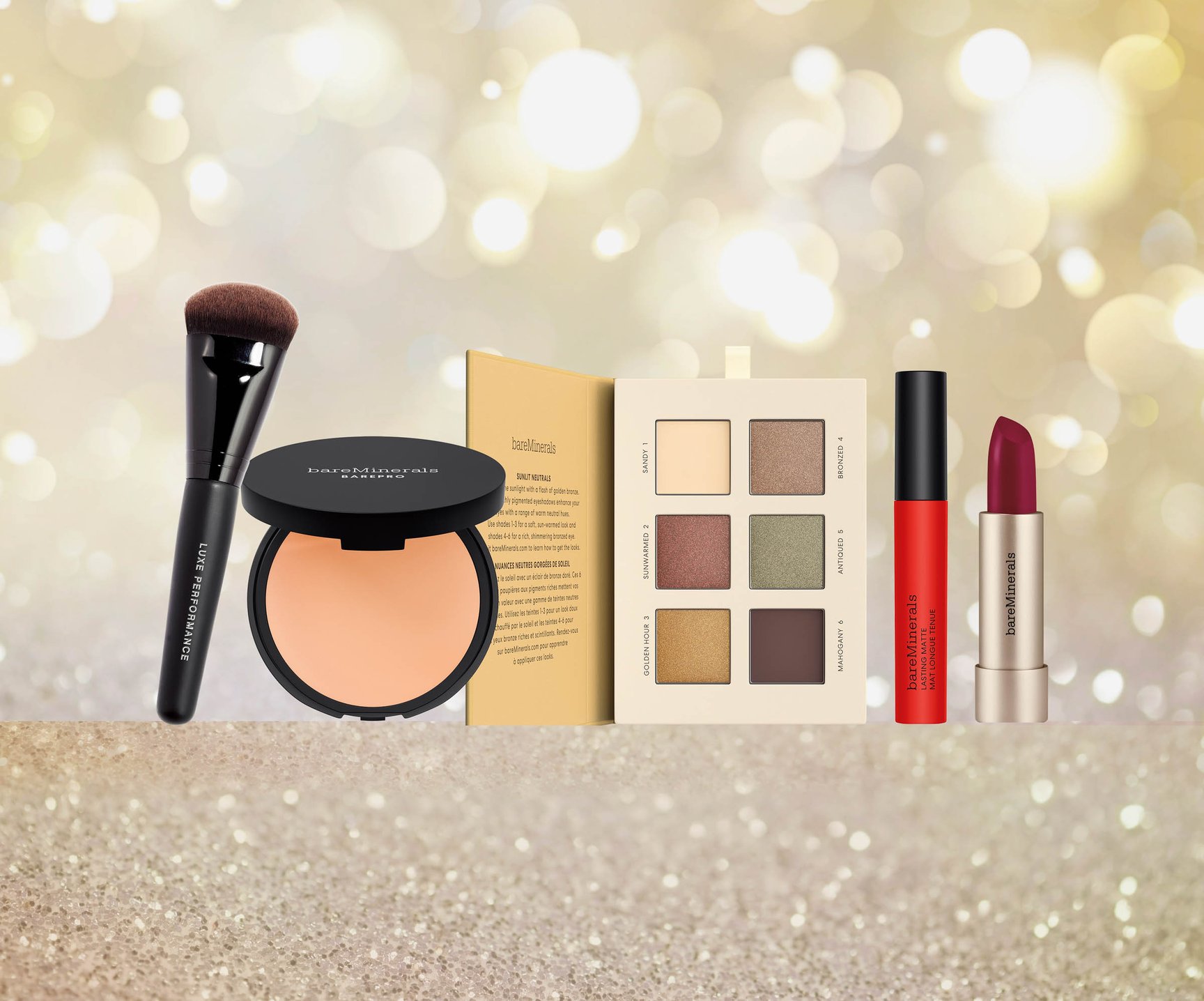 ゴールドの背景に置かれたコスメのキット