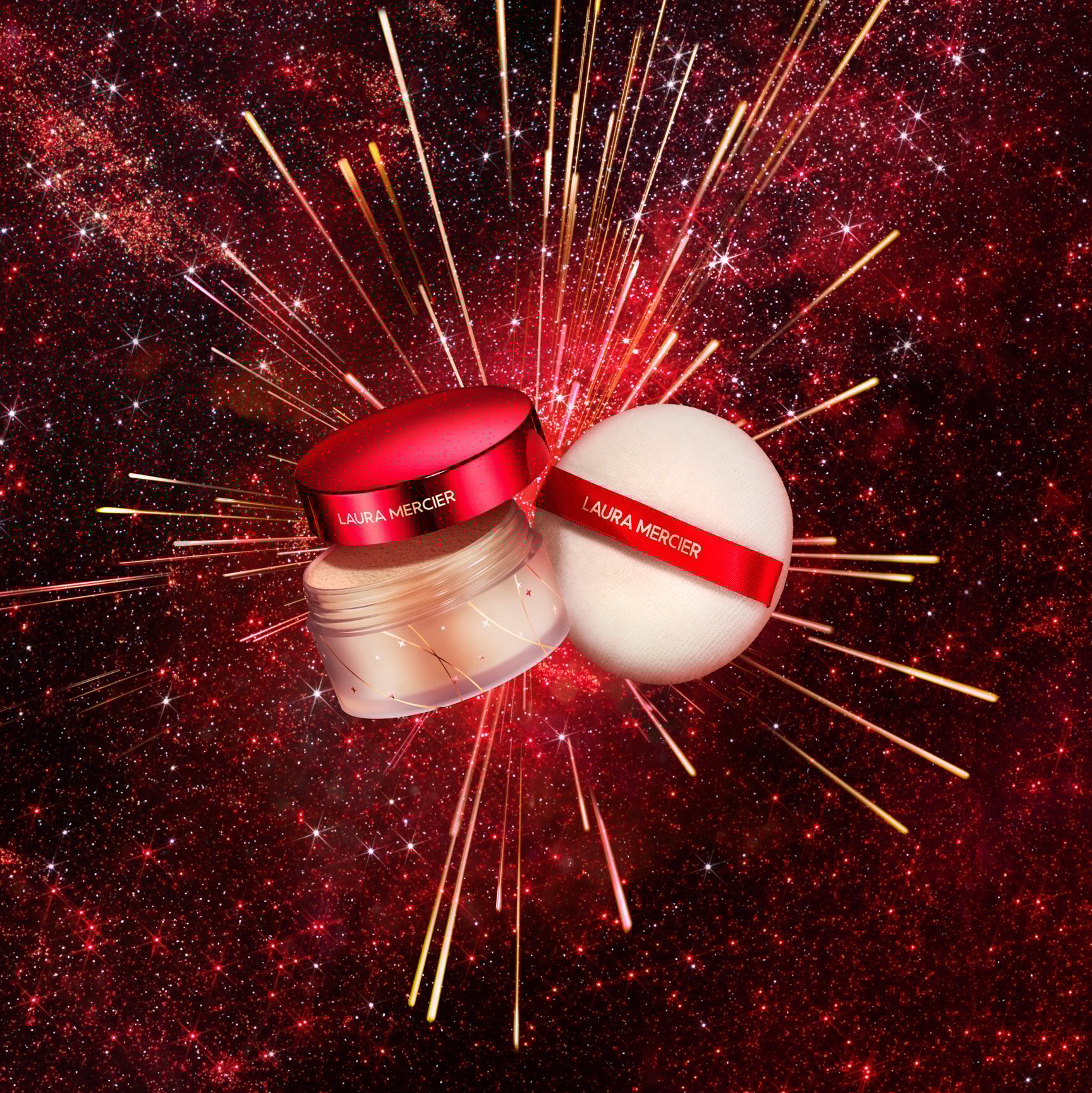 花火のように輝く背景に並んだフェイスパウダーとパフの写真