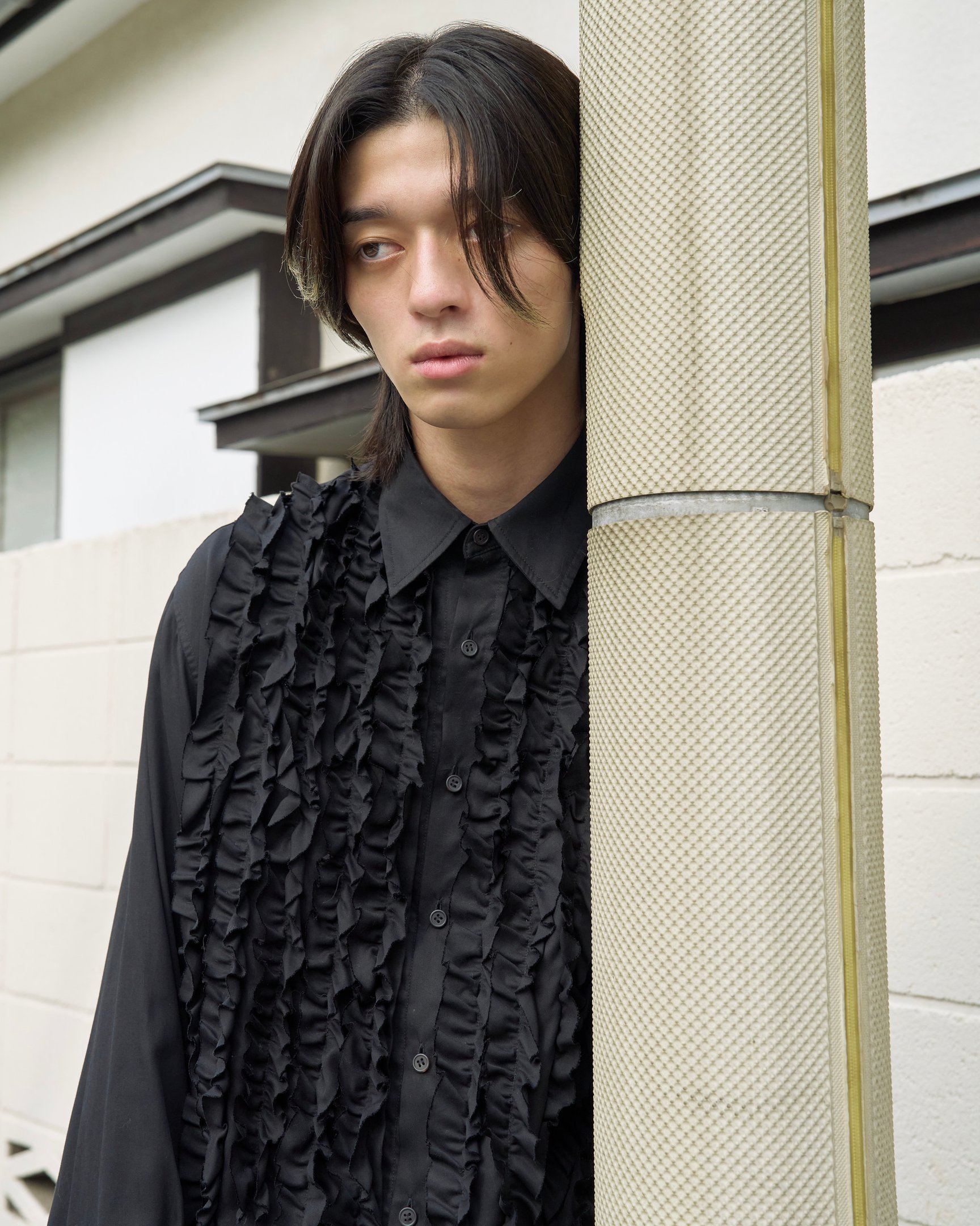 タークの洋服を着たモデル