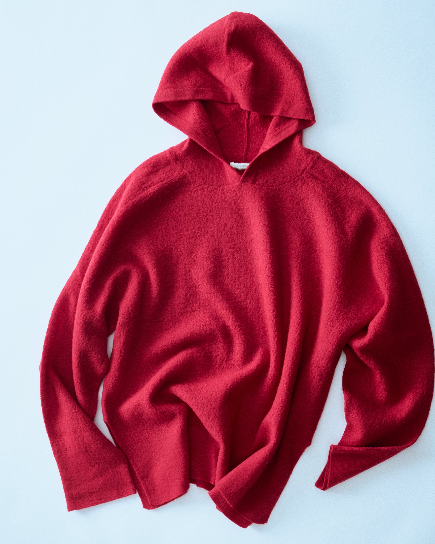 カナコサカイのニットフーディ