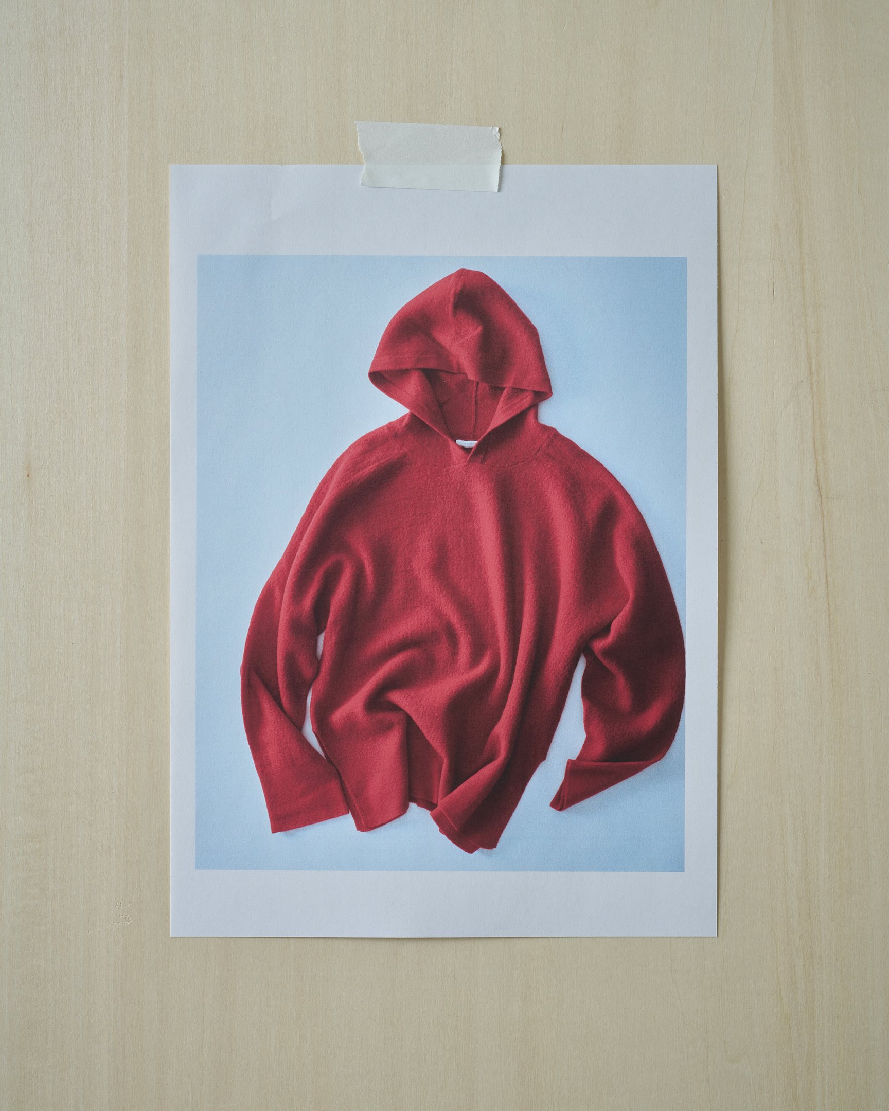 カナコサカイのニットフーディ