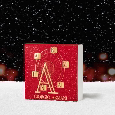 黒い背景の前に観覧車がデザインされた箱が置かれている画像