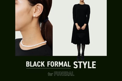 黒いワンピースとパールネックレス、ピアスを着用した女性