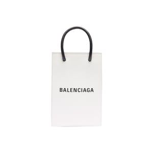 バレンシアガ、ブランドの紙袋を模したバッグラインから新作「フォン ホルダー」を直営店で発売